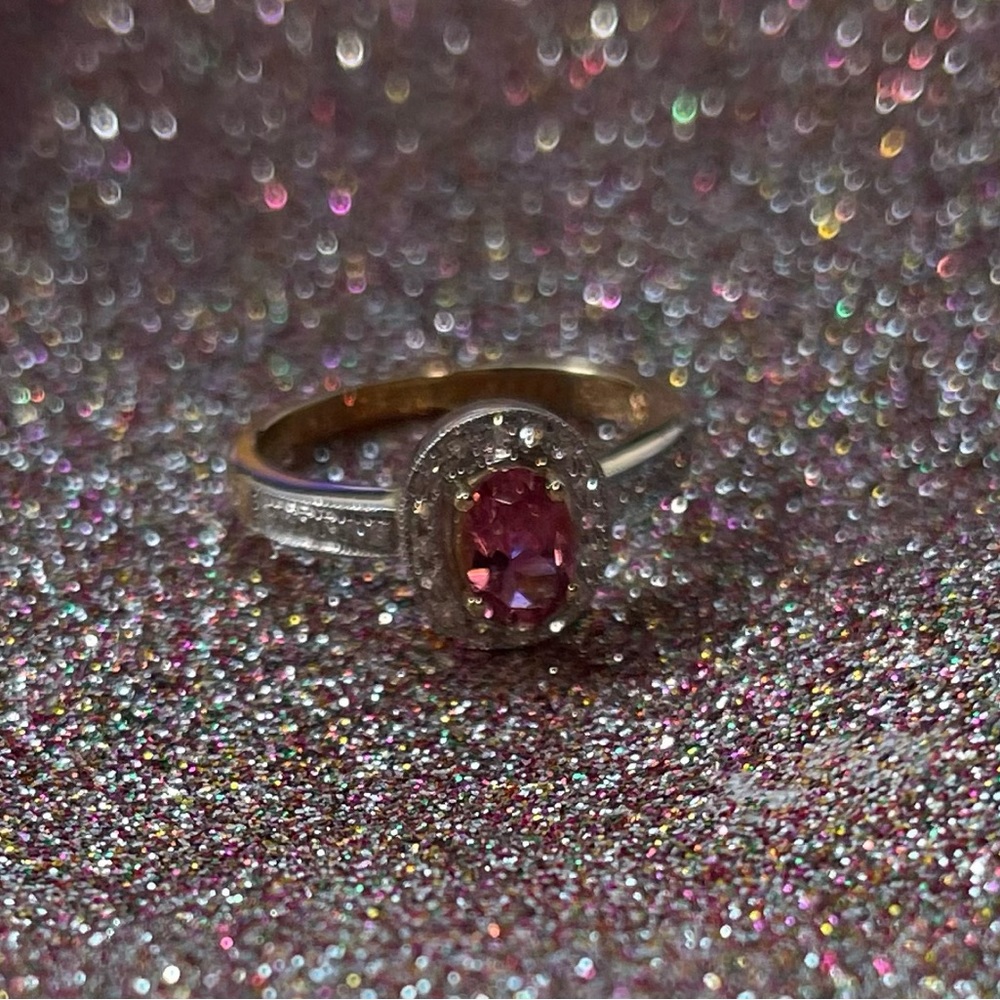 Size 8 14k gold with pink center stone.
